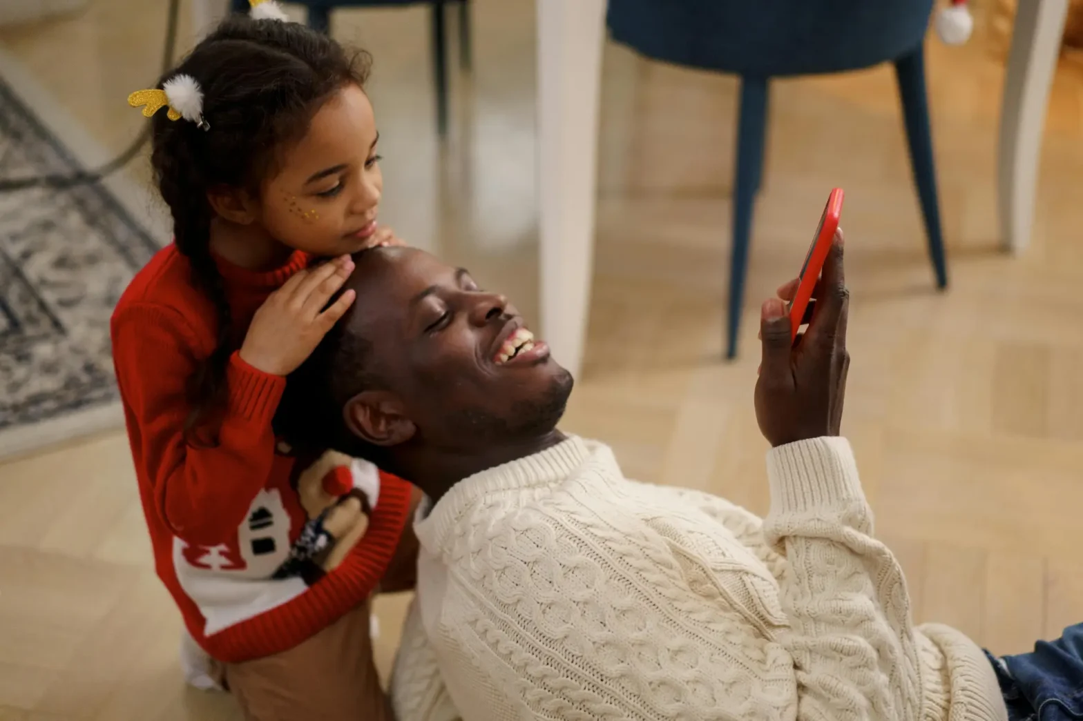 Happy Father and Daughter on a Safe Phone For Kids