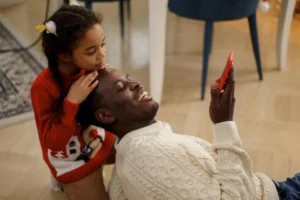 Happy Father and Daughter on a Safe Phone For Kids