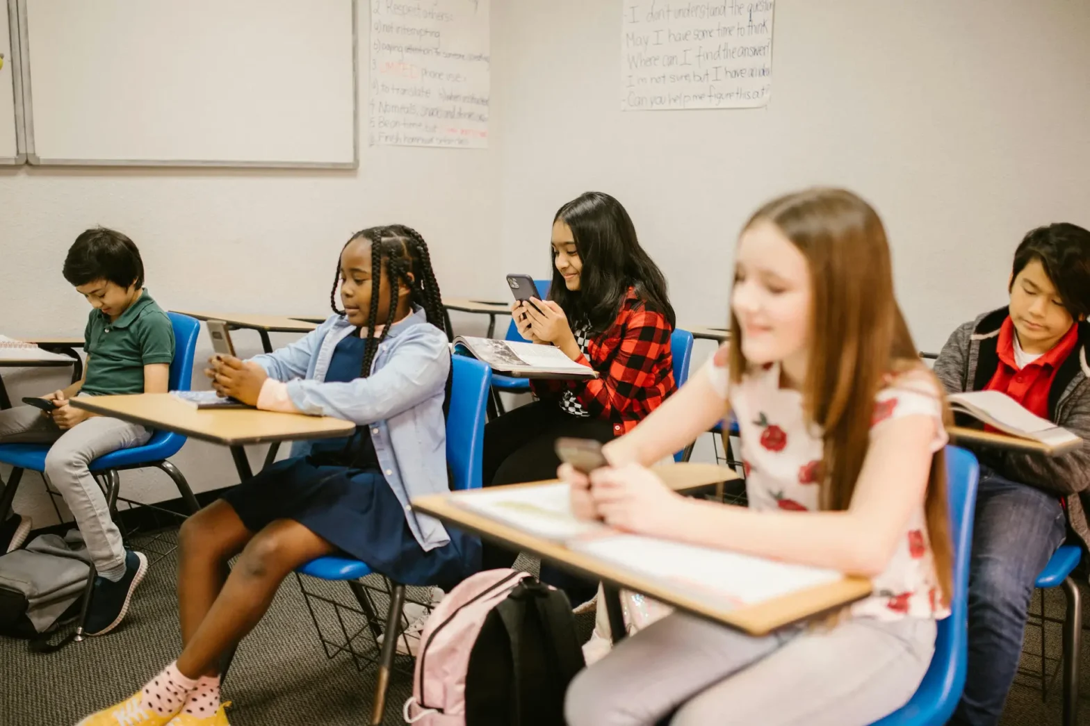 Children Using Phones in a Classroom